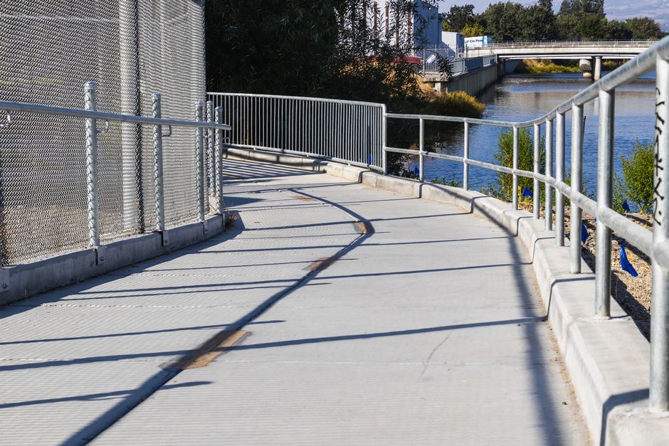 Concrete walkway being poured and finished